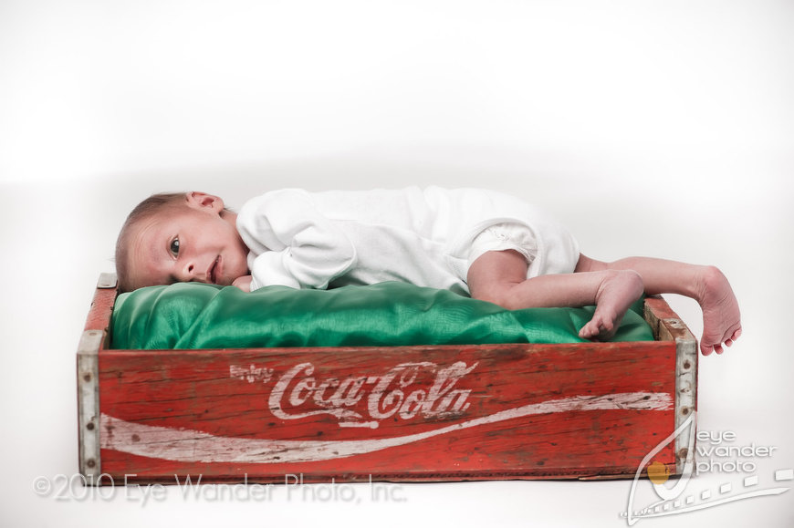 baby photography in Baton Rouge newborn with Coca Cola tray
