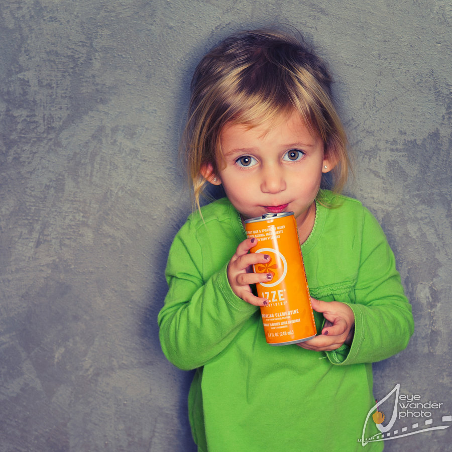 intense color portrait of girl with izze drink