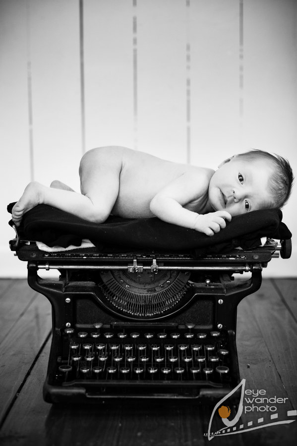 newborn on vintage typewriter