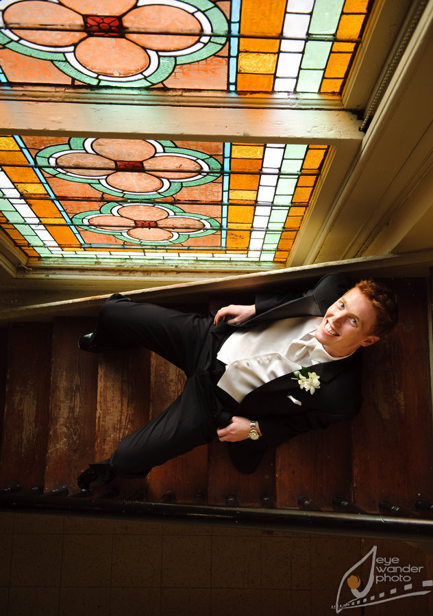 Louisiana Wedding Groom Sits Near Stained Glass