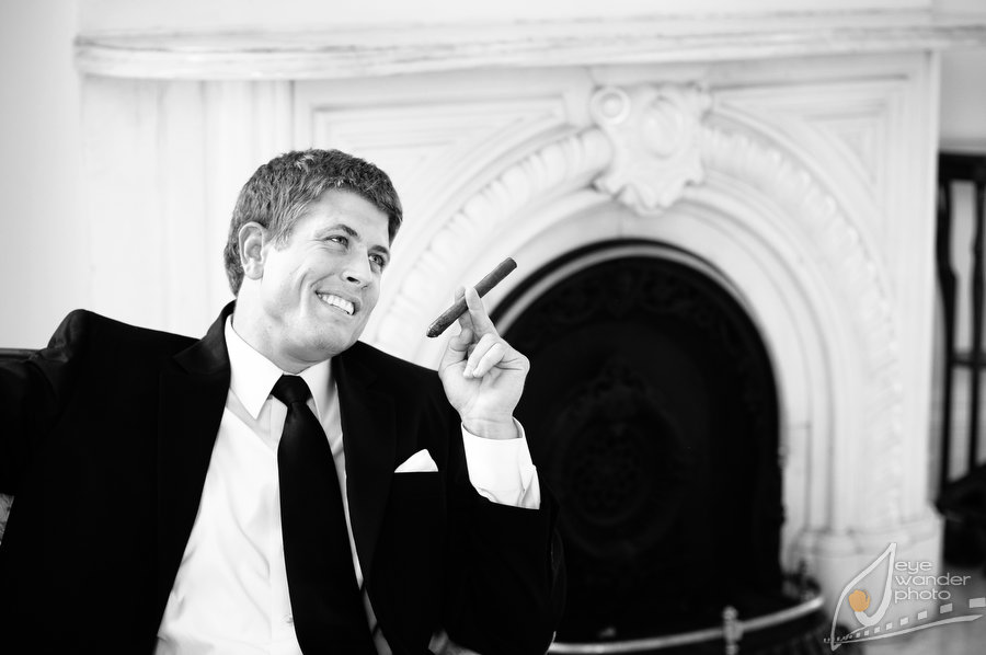 Louisiana Nottaway Plantation Wedding Groomsmen Smokes Cigar Fireplace