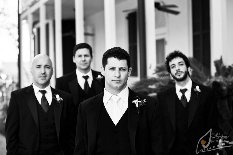 Nottoway Plantation Wedding Groom and Groomsmen Stand in front of Pillars