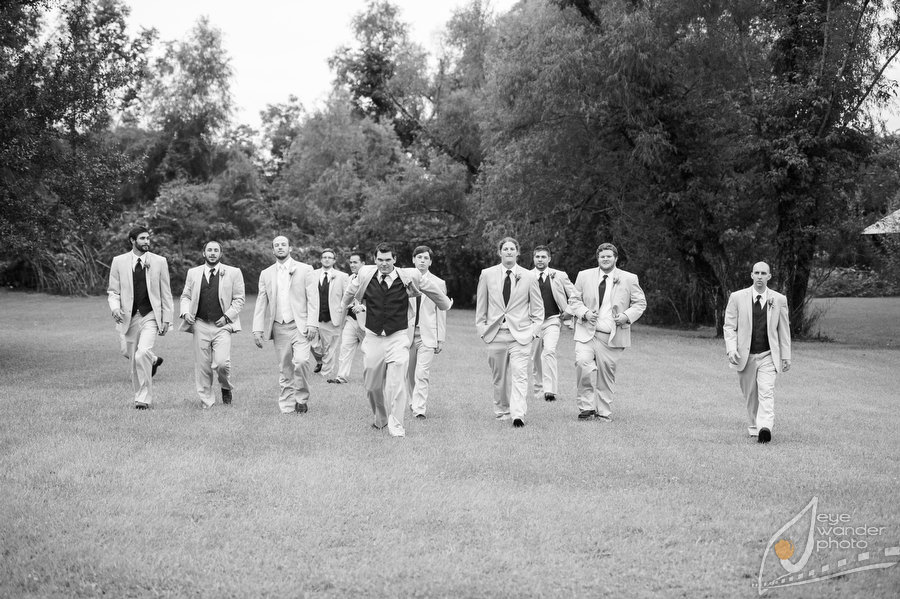 Baton Rouge Wedding Groom Groomsmen Charge camera Outside 