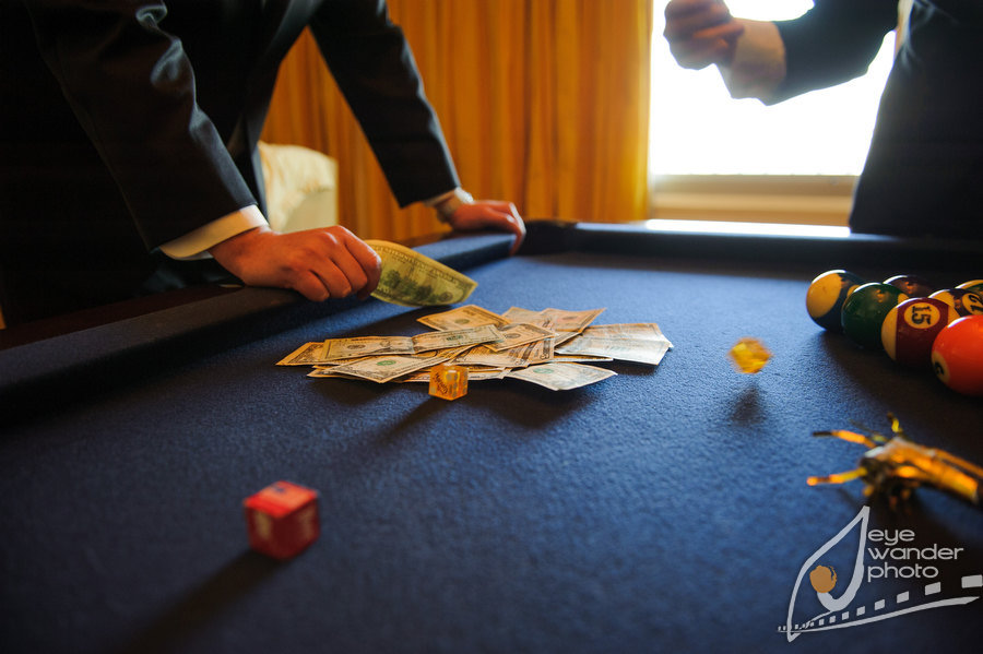 New Orleans Wedding Groomsmen gamble on Pool Table
