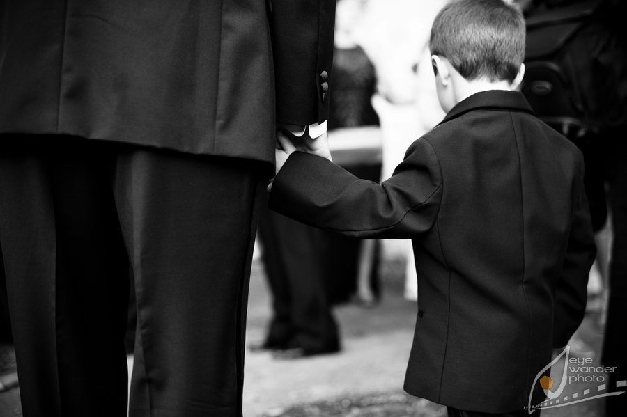 New Orleans Wedding Wedding Groom and Boy in Suit Holding Hands
