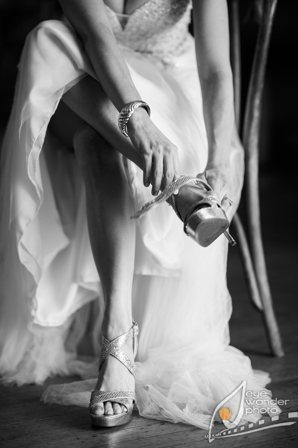 Louisiana Wedding Bridal putting on wedding shoes Black and white