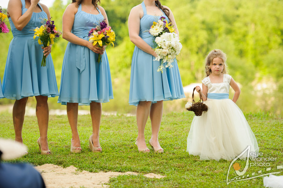 Kids at weddings sassy flower girl next to brides maids